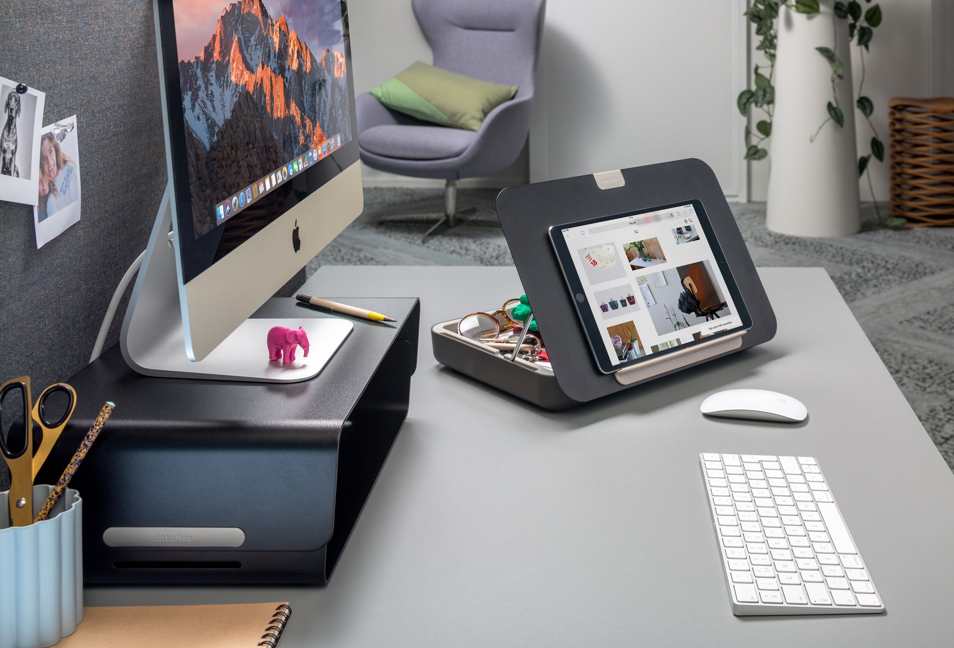 Bento monitor riser in black on a desk with ergonomic toolbox