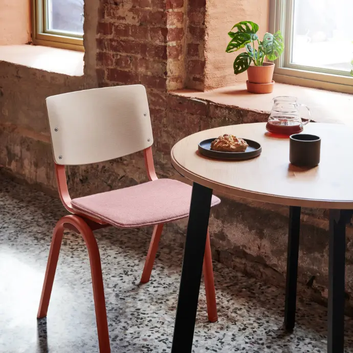 HÅG Celi 9240 chair in wood with Blush Rose frame and Camira Mainland Flax MLF 03 upholstery, in café-restaurant setting